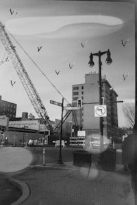 a black and white photo of a crane